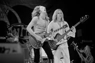 Live on stage (Image via Getty)